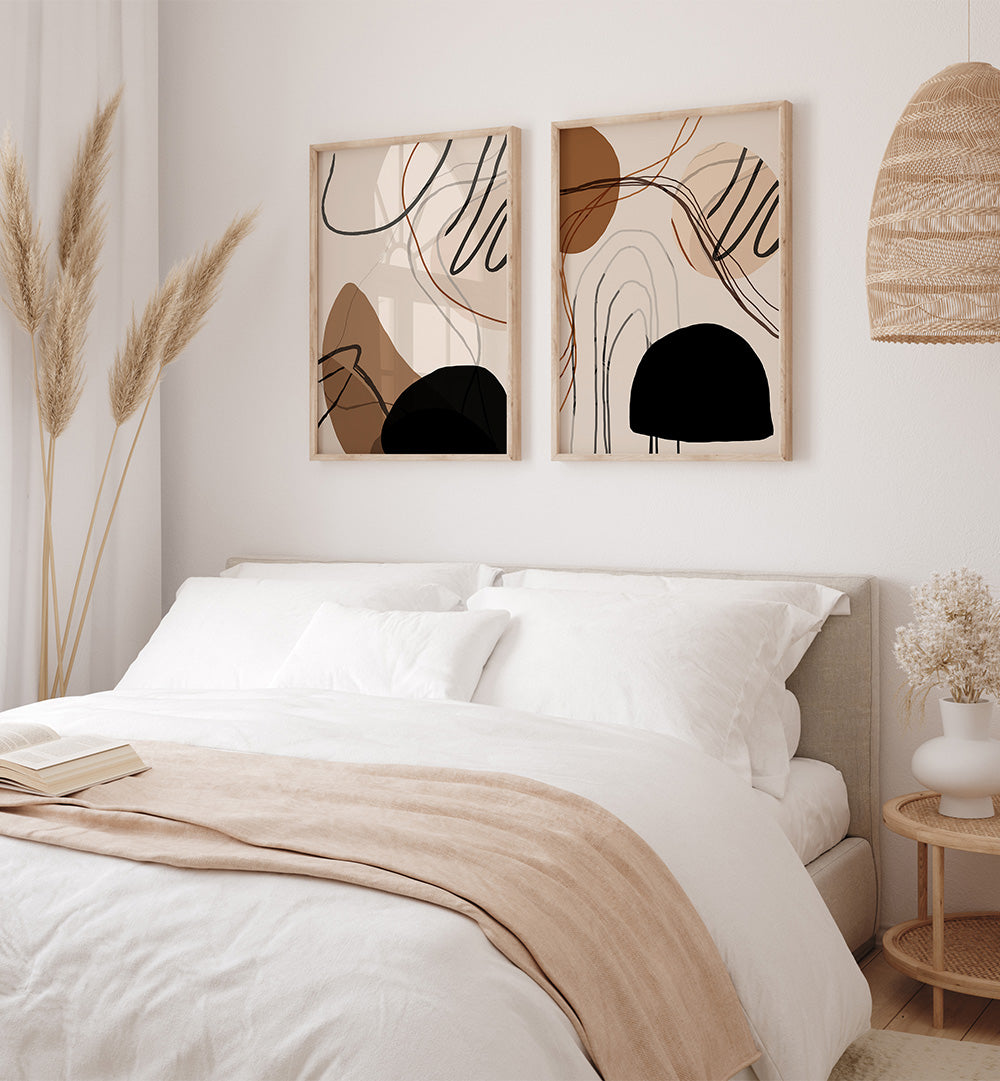 Neatly made bed with abstract wall art in a bedroom setting