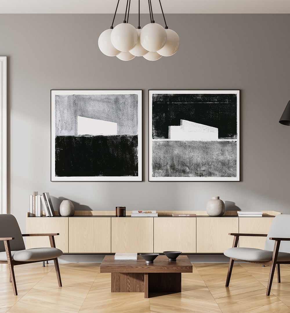 Modern living room with abstract art on the wall, neutral color scheme.