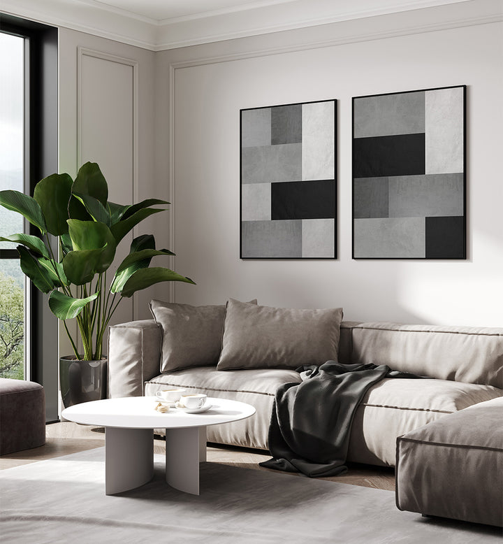 Modern living room with a sectional sofa, coffee table, and abstract wall art.