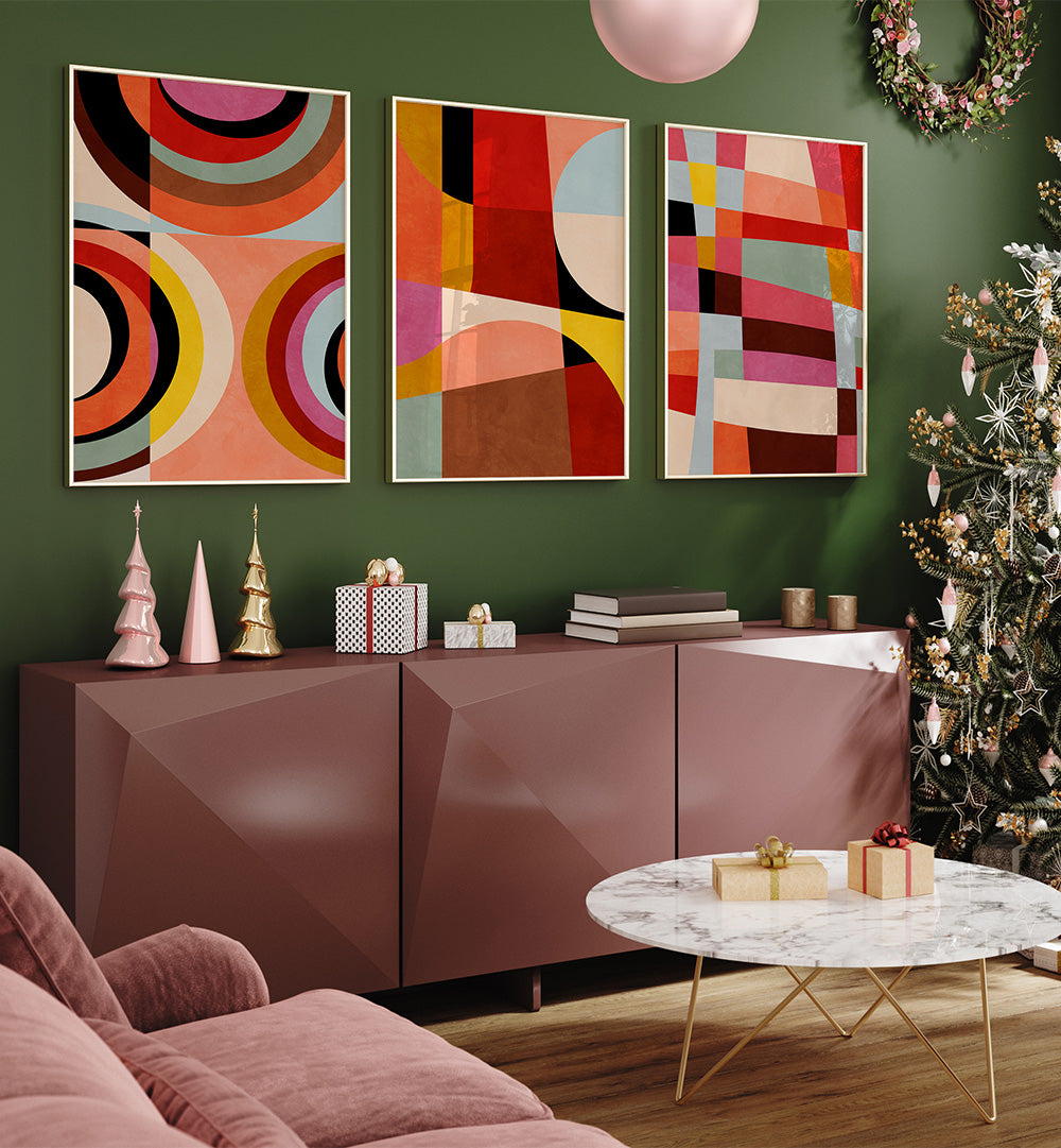 Living room with abstract art on a green wall, a sideboard, and a Christmas tree.