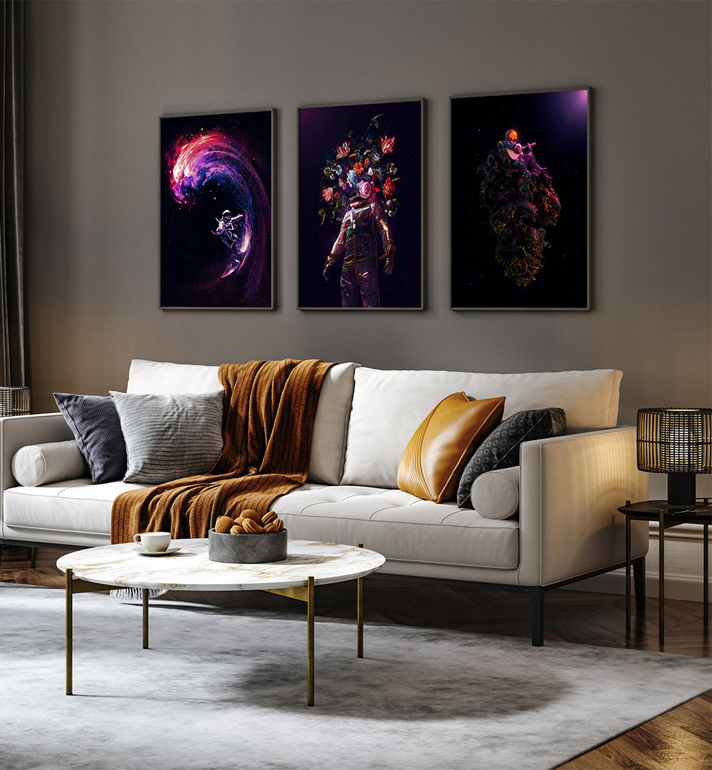 Modern living room with a white sofa, coffee table, and three abstract wall art pieces.