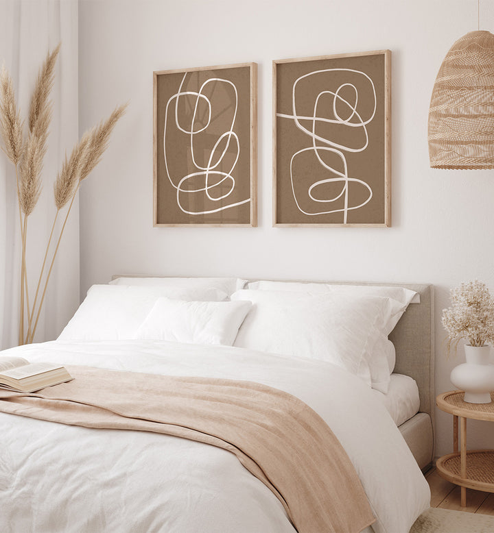Neatly made bed with abstract wall art in a bedroom setting