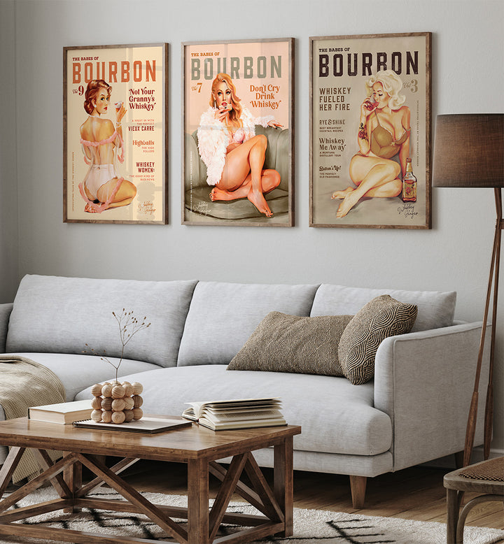 Living room with a gray sofa, wooden coffee table, and bourbon-themed posters on the wall.