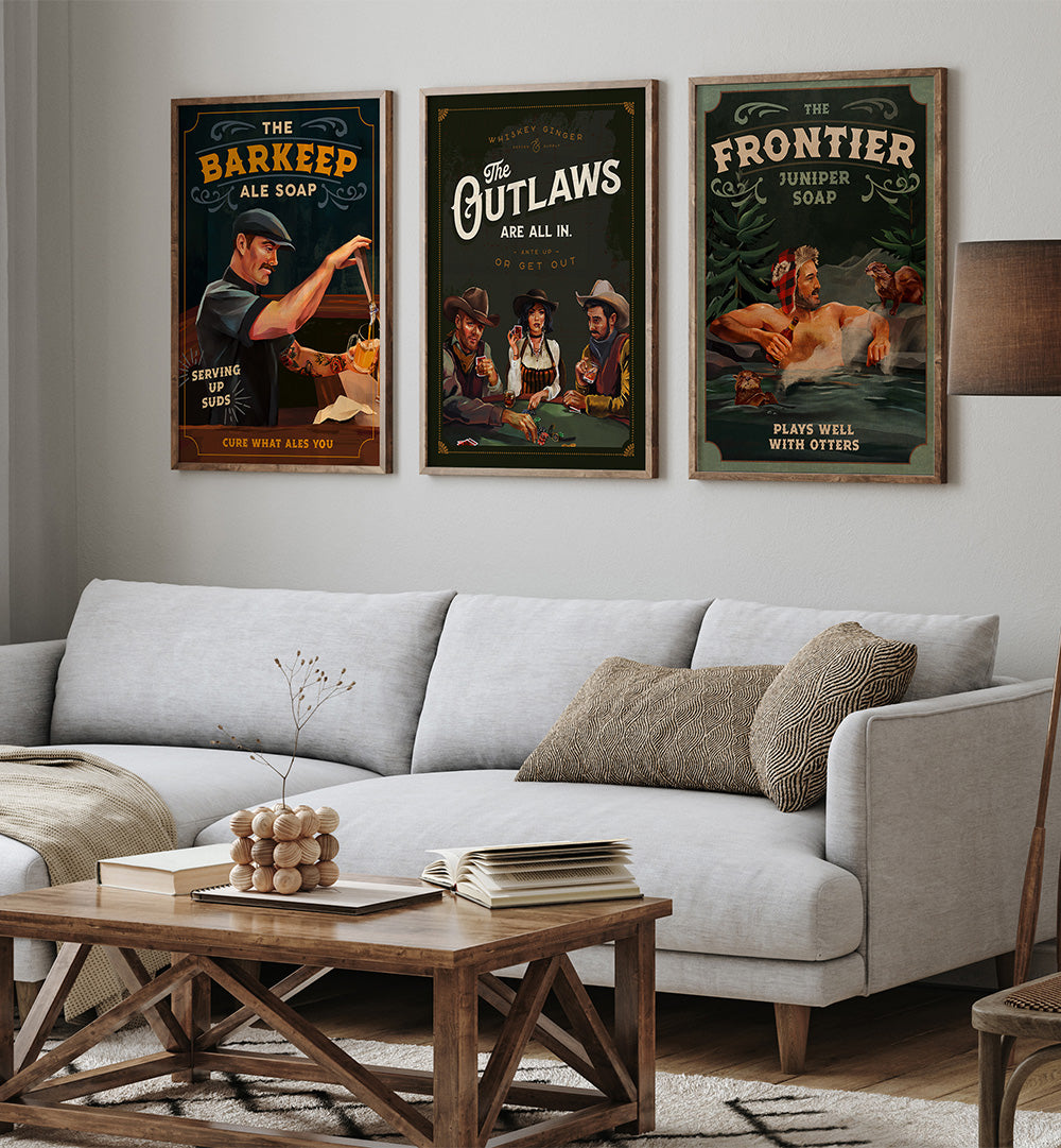 Living room with a gray sofa, wooden coffee table, and framed posters on the wall.