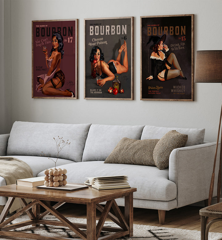 Living room with a gray sofa, wooden coffee table, and bourbon-themed posters on the wall.