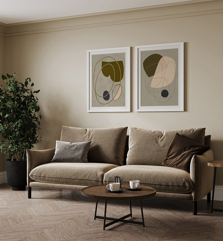 Modern living room with a beige sofa, abstract art on the wall, and a coffee table.