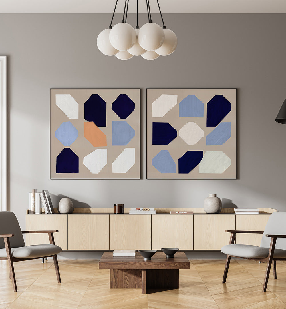 Modern living room with abstract wall art, furniture, and decor.