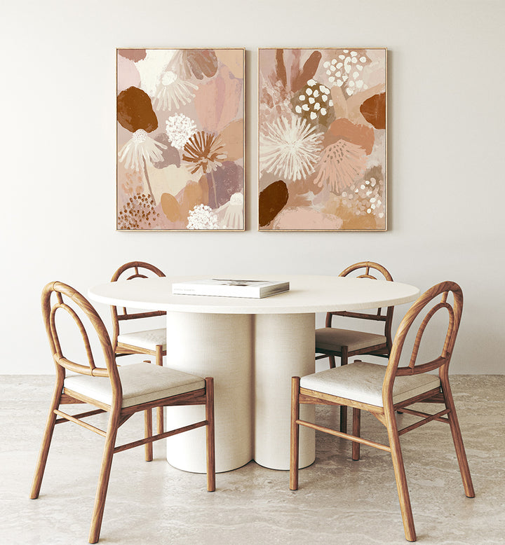 Dining room with a round table and chairs, featuring abstract floral artwork on the wall.