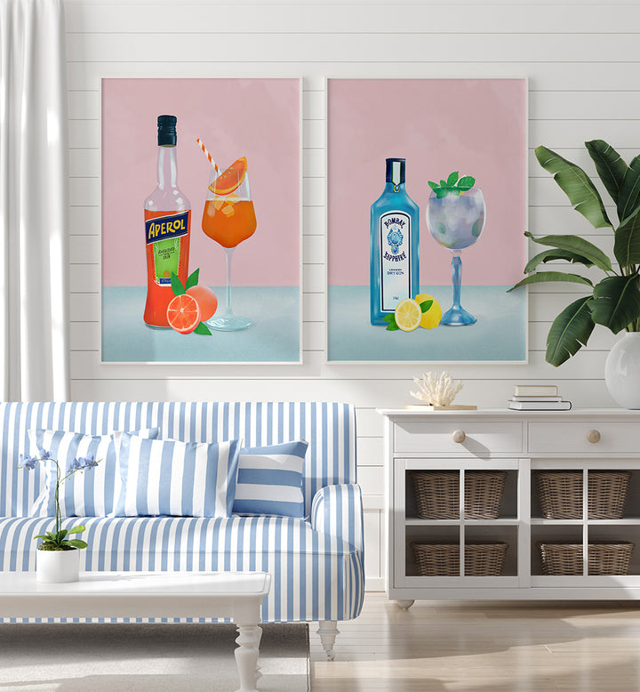 Living room with striped sofa, coffee table, and two cocktail-themed wall art prints.