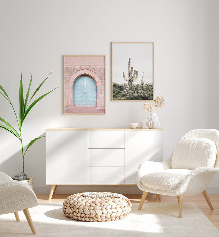 Modern living room with white furniture, plants, and wall art.