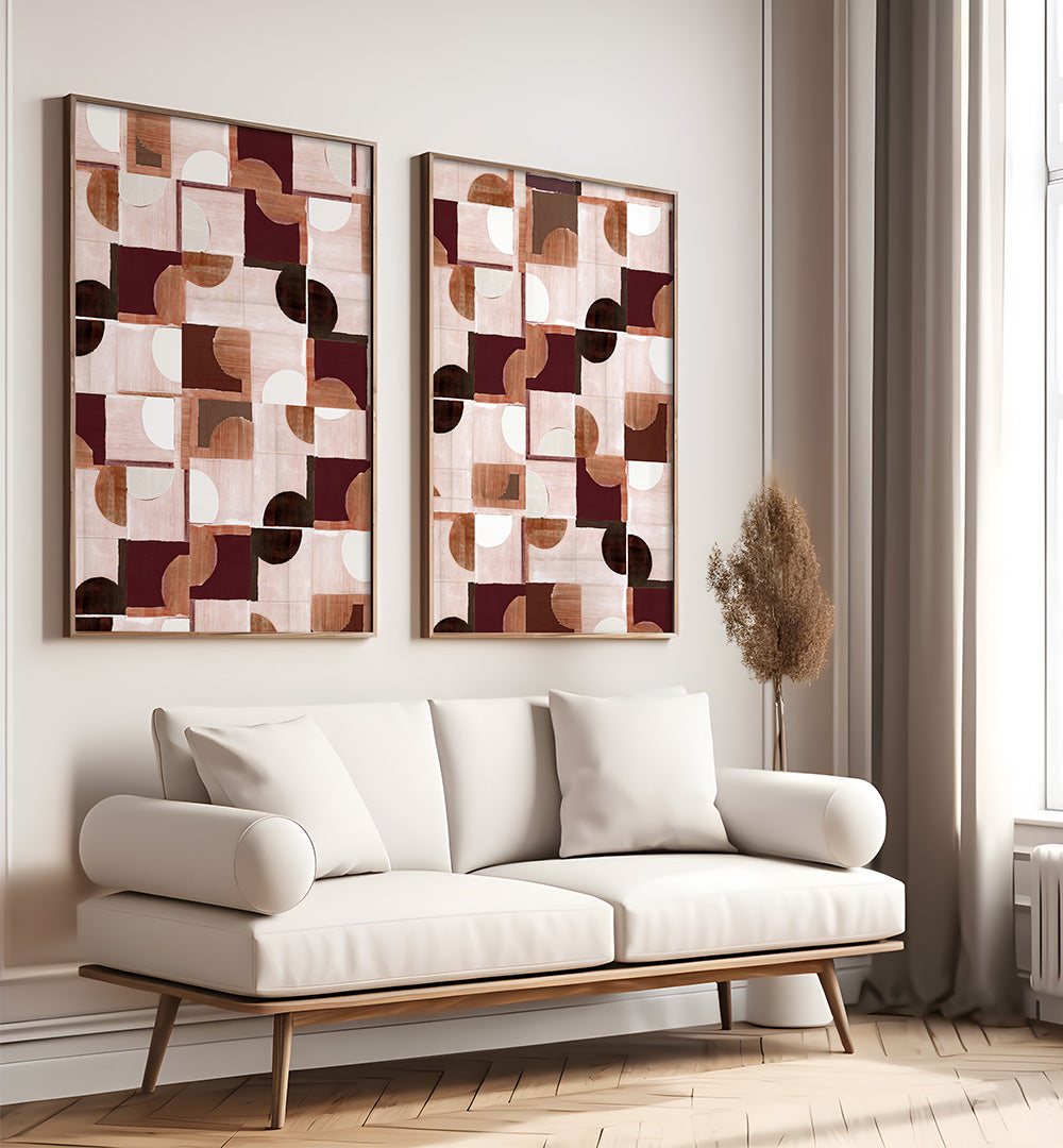 White sofa in a room with abstract wall art and a window.