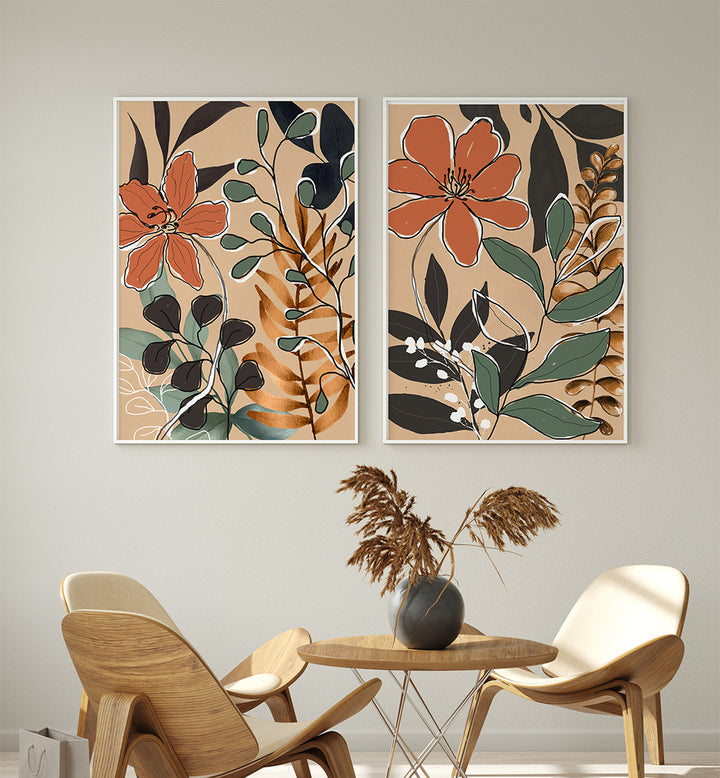 Two floral wall art pieces above a table with chairs in a room setting.