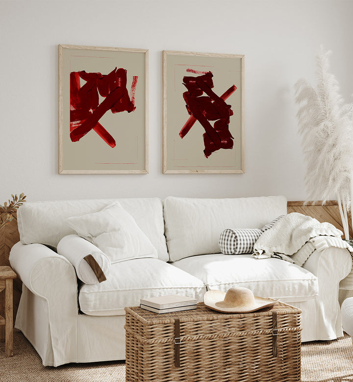 White sofa with decorative pillows in a living room with red abstract art on the wall.