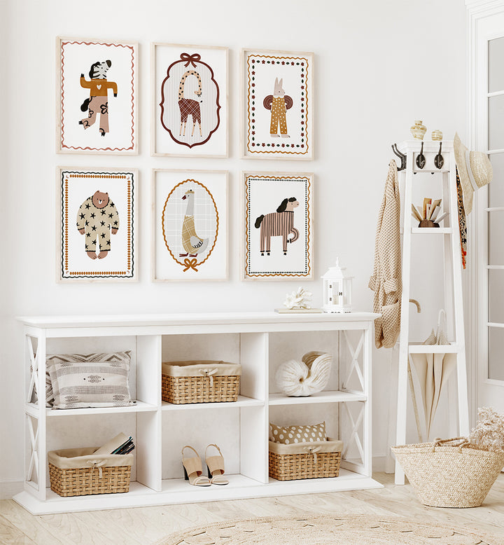Nursery room with white wall, shelves, and framed animal prints.
