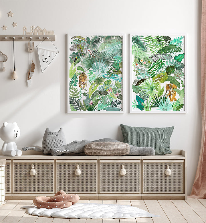 Two framed tropical leaf prints above a bench with decorative pillows and a teddy bear.