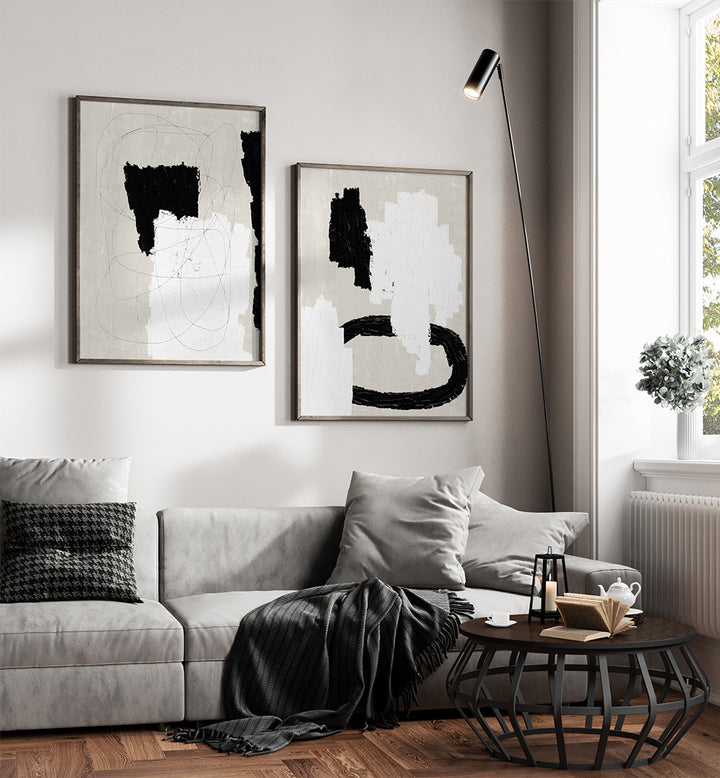 Modern living room with abstract art, gray sofa, and coffee table.