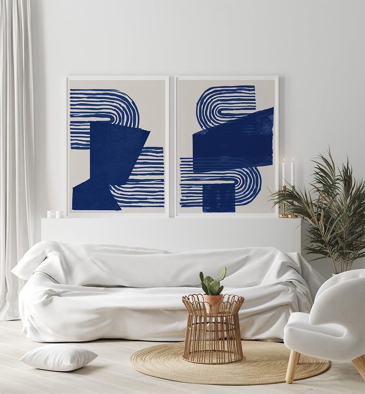 Modern living room with abstract blue artwork on a white wall