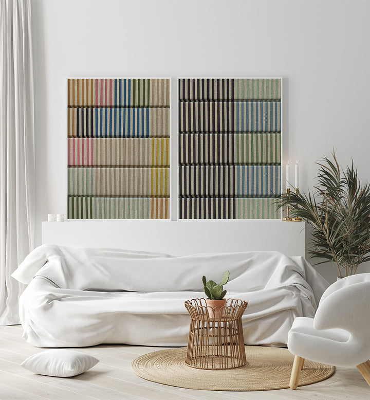 Modern living room with a white sofa, decorative pillows, and abstract wall art.