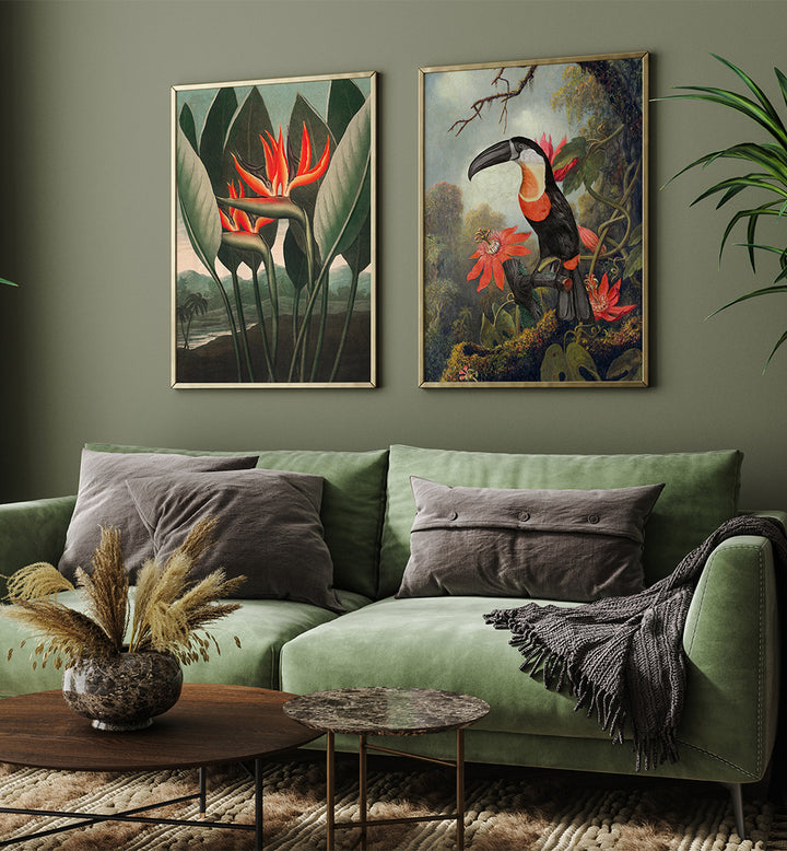 Green sofa with gray pillows in a living room with two framed artworks on the wall.