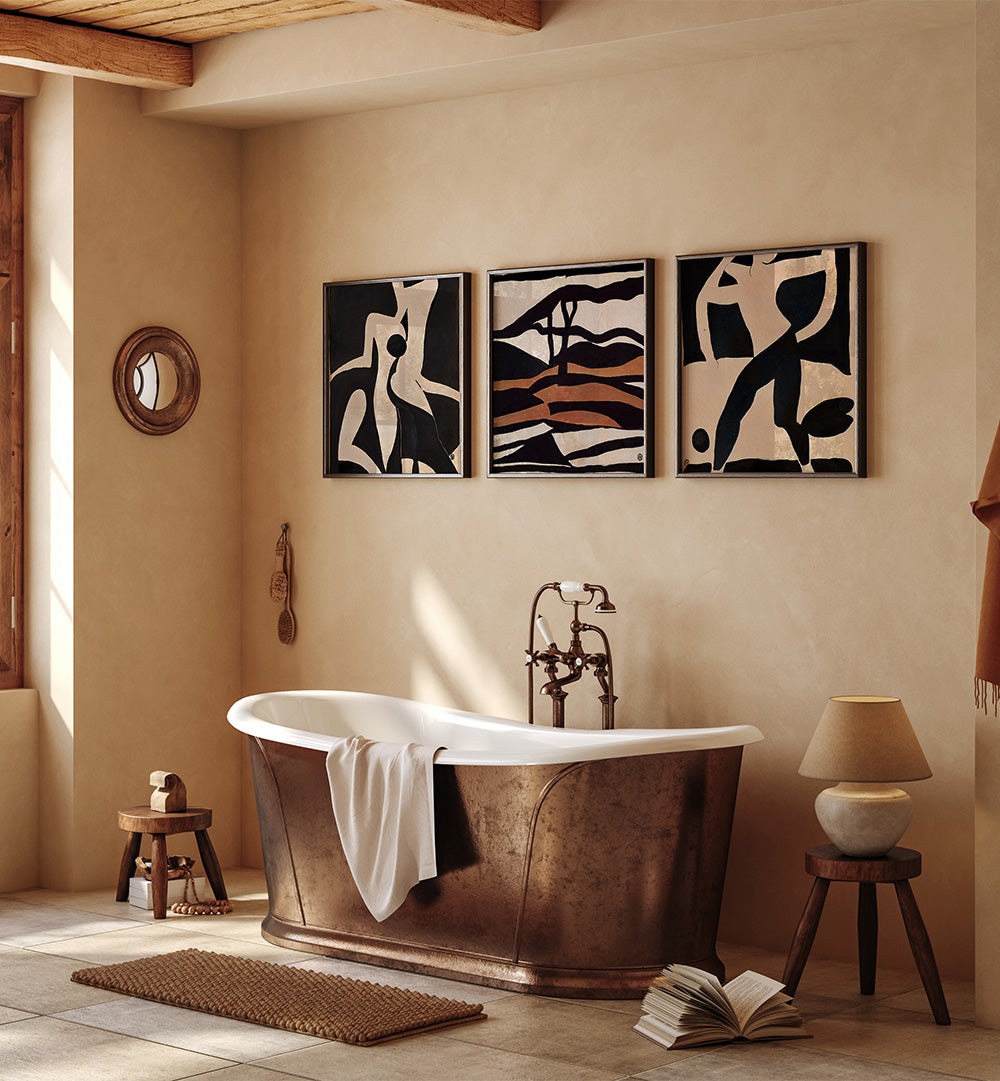 Bathroom with a freestanding bathtub, framed art on the wall, and decorative elements.