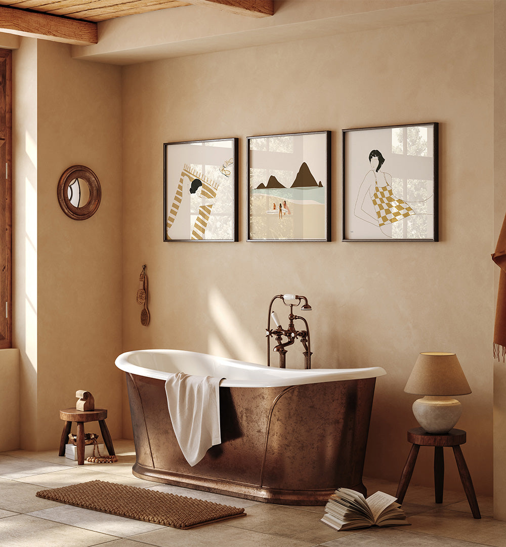 Bathroom with a freestanding bathtub, framed art on the wall, and decorative elements.