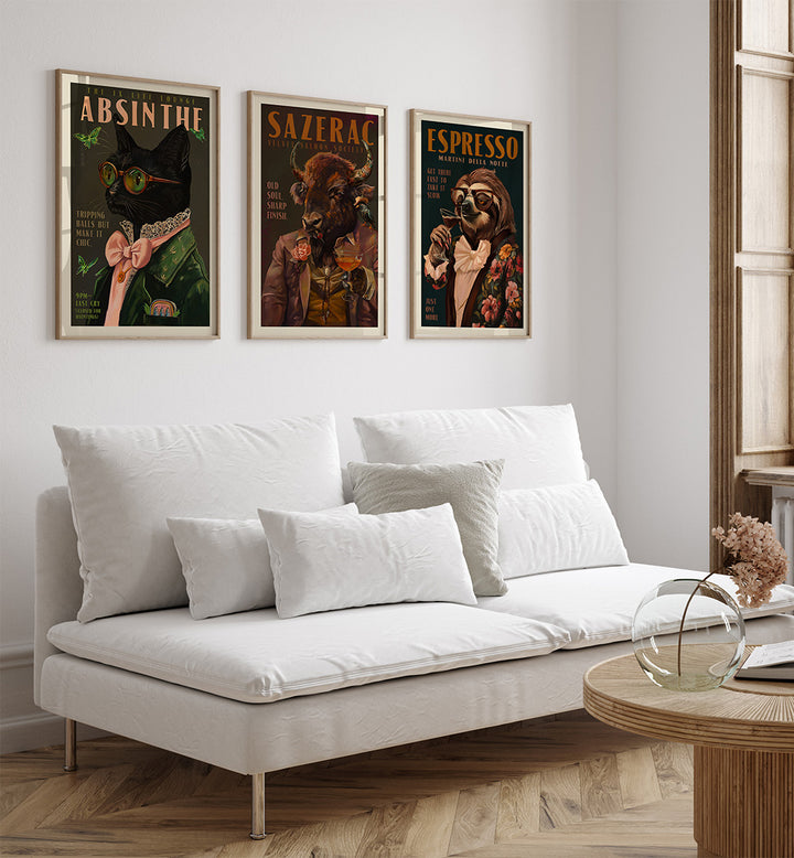 White sofa with decorative pillows in a room with framed posters on the wall.