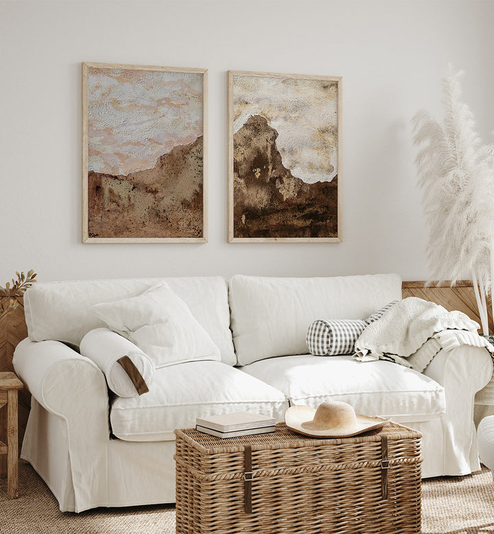 Cozy living room with a white sofa, wicker coffee table, and abstract wall art.