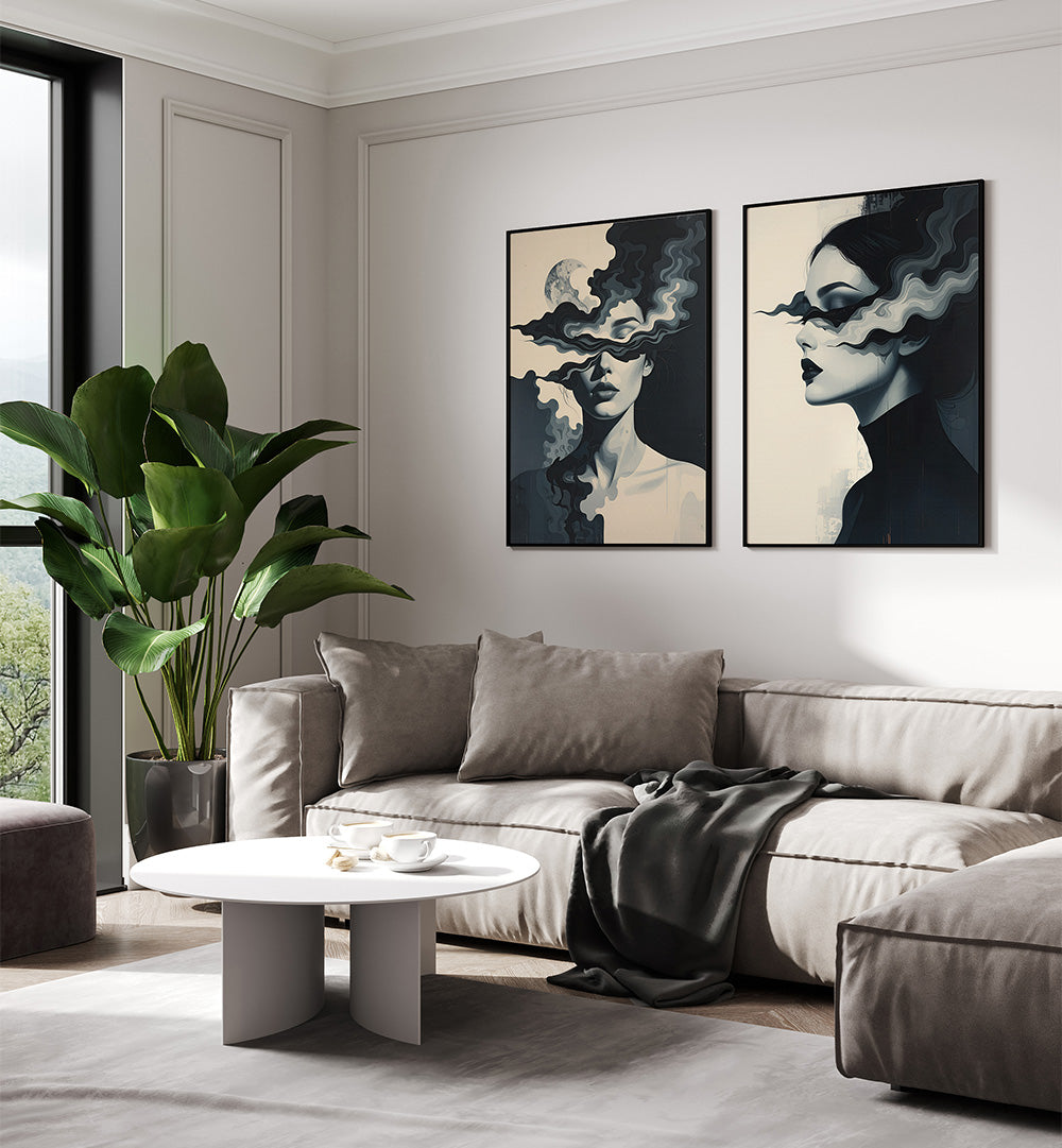 Modern living room with a gray sectional sofa, round coffee table, and abstract art on the wall.