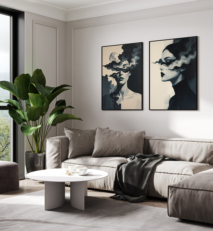 Modern living room with a gray sectional sofa, round coffee table, and abstract art on the wall.