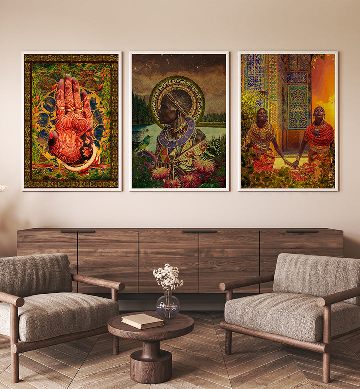 Three framed artworks on a wall above a wooden cabinet in a living room.