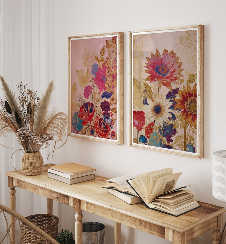 Floral framed artwork on a wall above a wooden console table with books and decor.