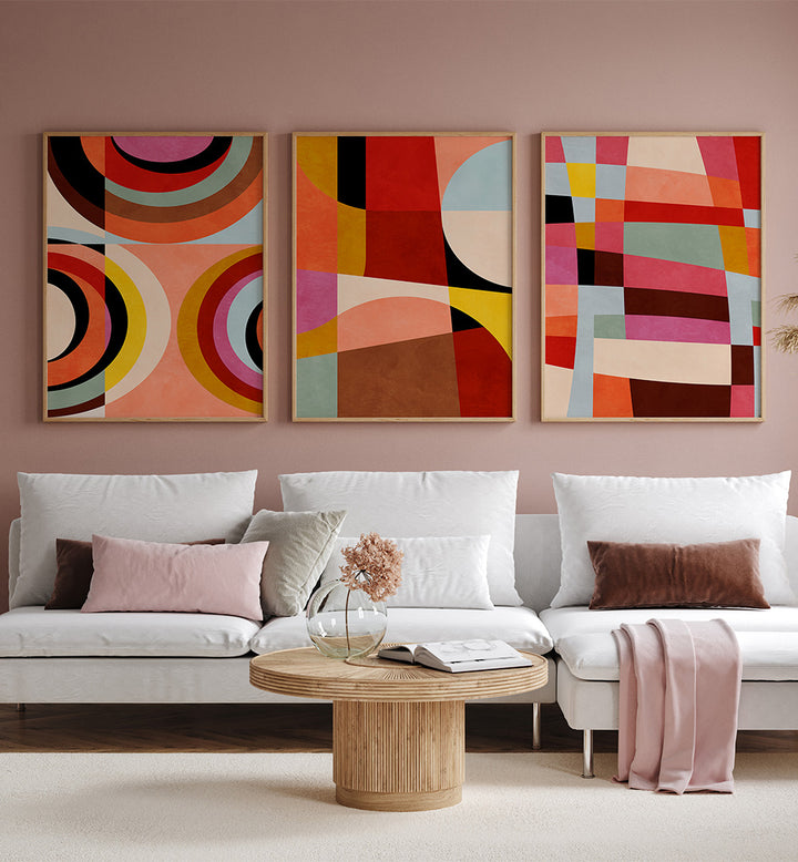 Living room with a white sofa, wooden coffee table, and abstract art on the wall.