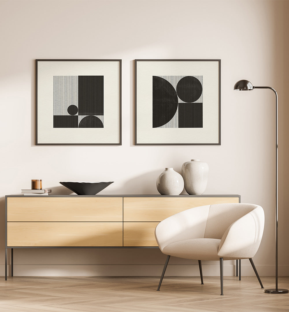 Modern interior with a wooden sideboard, white chair, and abstract art on a beige wall.