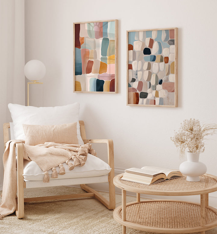 Living room with a wooden armchair, coffee table, and abstract wall art.