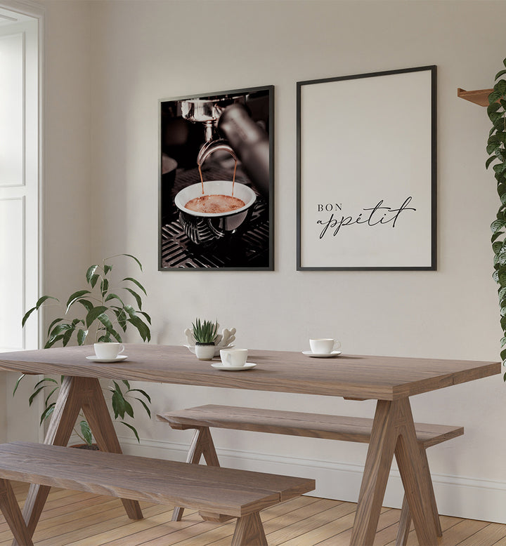 Dining room with wooden table and benches, framed art on the wall, and plants.