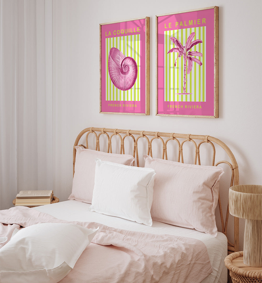 Bedroom with pink and green posters on the wall above a bed.