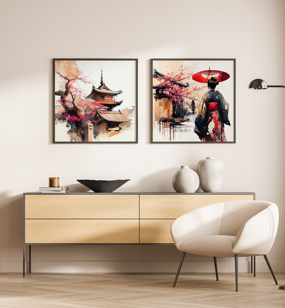 Two framed artworks on a wall above a wooden cabinet with decorative items.