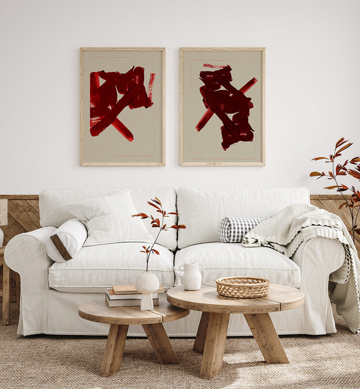 Living room with a white sofa, wooden coffee tables, and abstract red art on the wall.