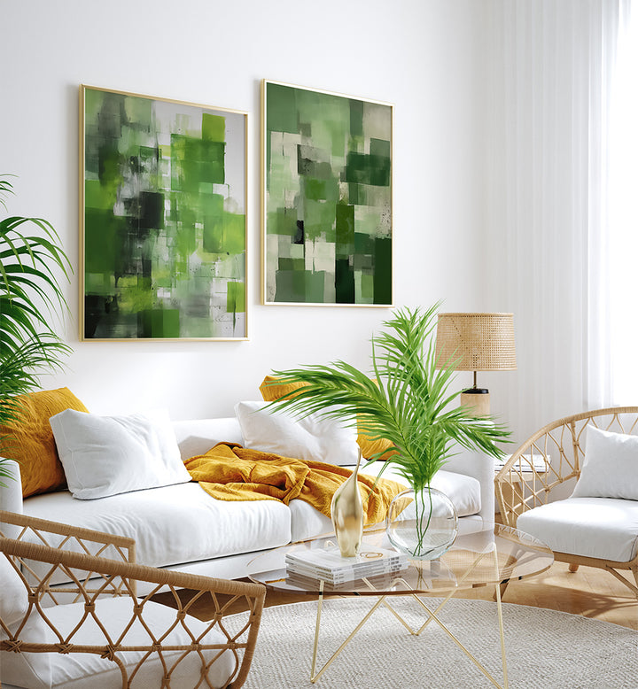 Modern living room with white sofa, wicker chairs, and abstract green artworks on the wall.