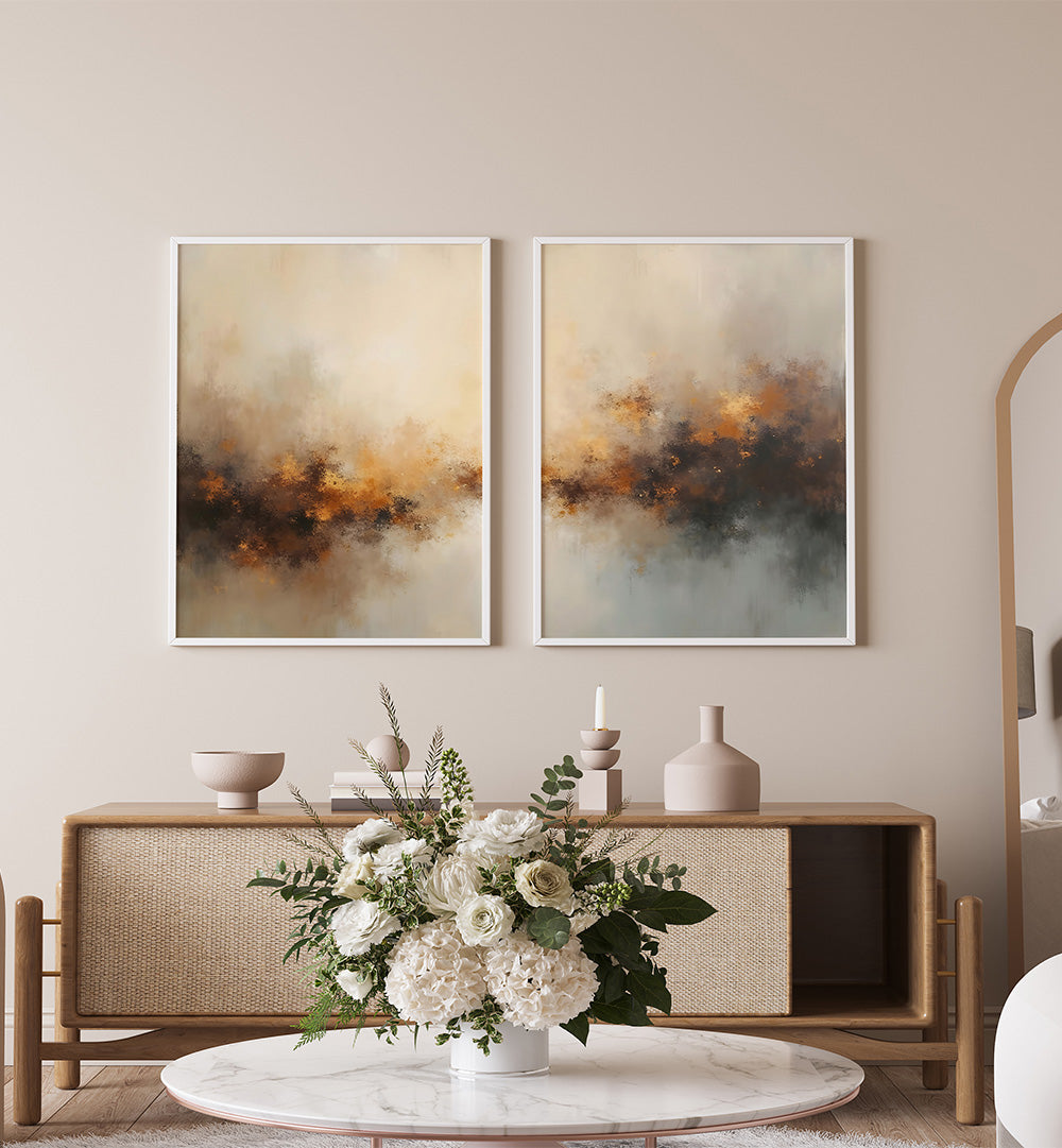 Two abstract paintings on a wall above a wooden console table with decorative items.