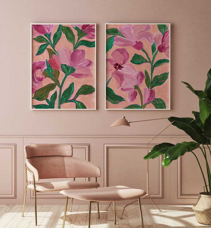 Floral artwork on a wall with a chair and plant in a room.