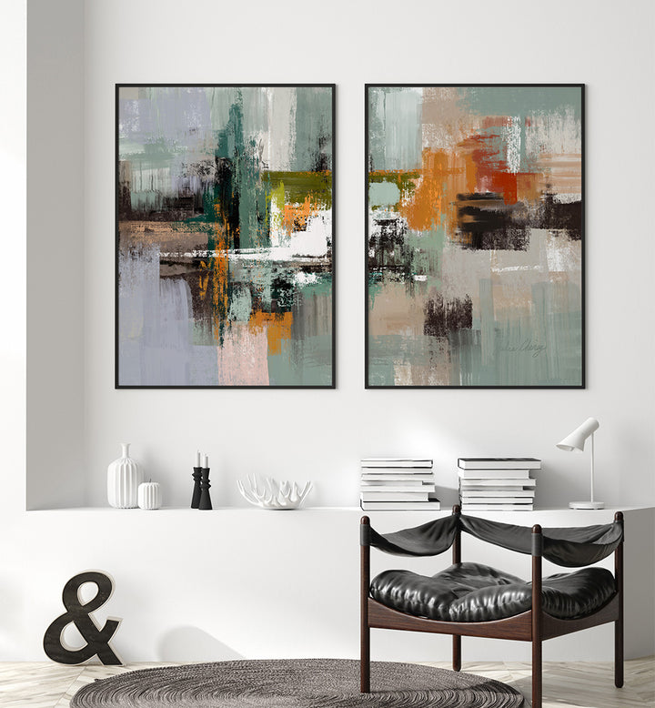 Two abstract art pieces on a wall above a dining table with chairs.