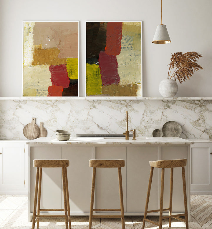 Modern kitchen with abstract art on the wall, marble countertop, and wooden stools.