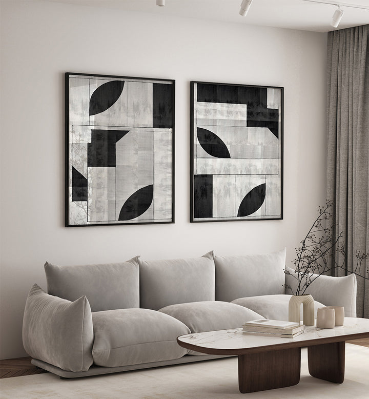 Modern living room with abstract art on the wall and a gray sofa.