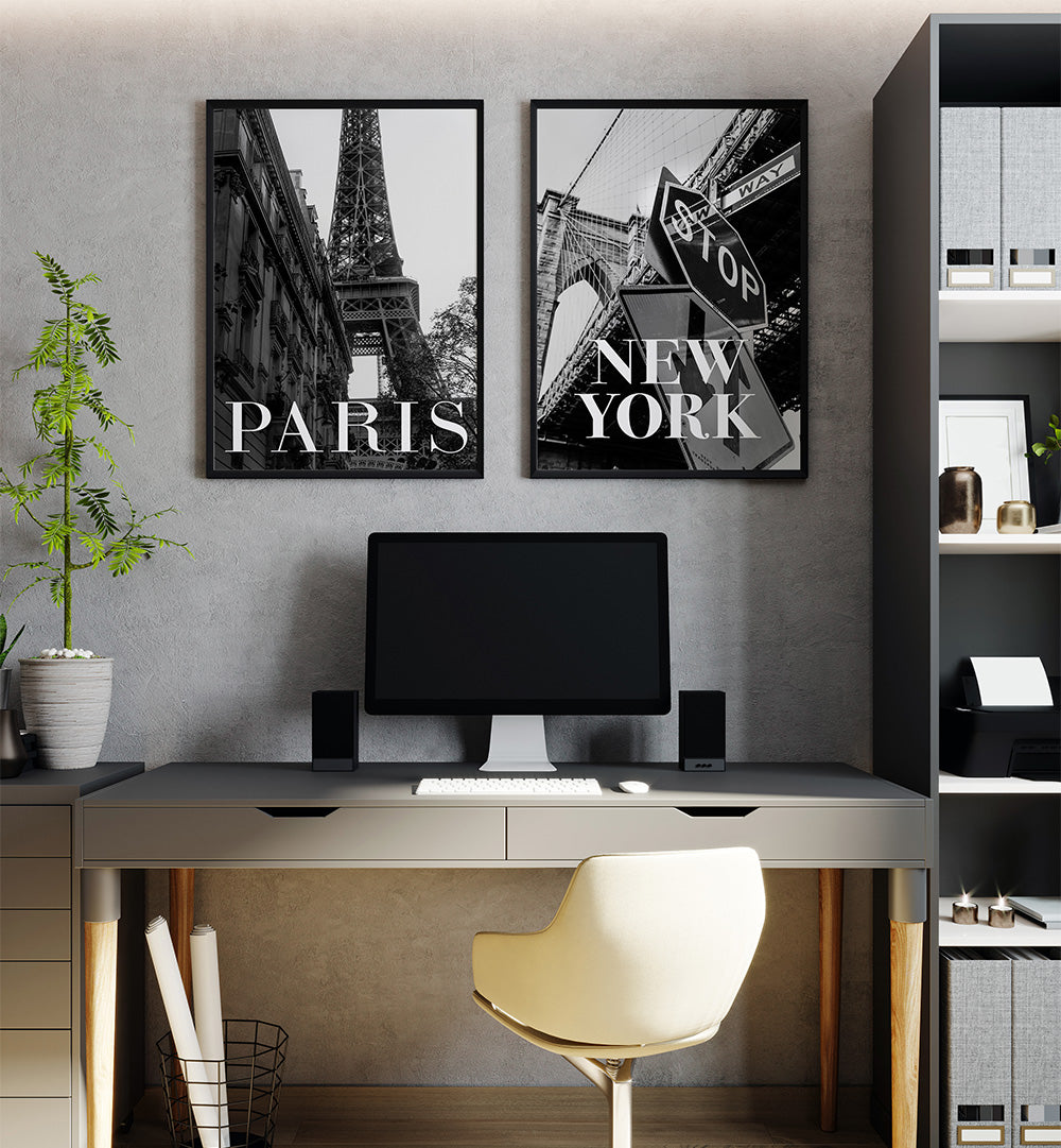 Modern office setup with 'Paris' and 'New York' wall art, computer desk, and chair.