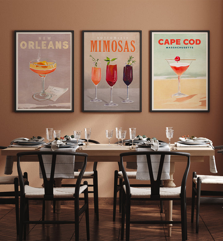Dining room with framed cocktail posters on the wall