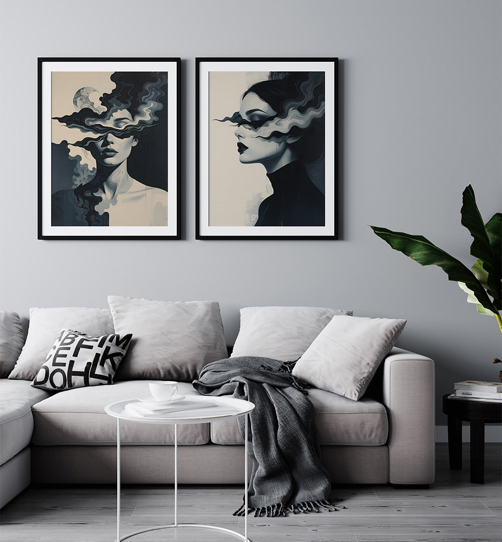 Living room with a gray sofa, decorative pillows, and two framed artworks on the wall.