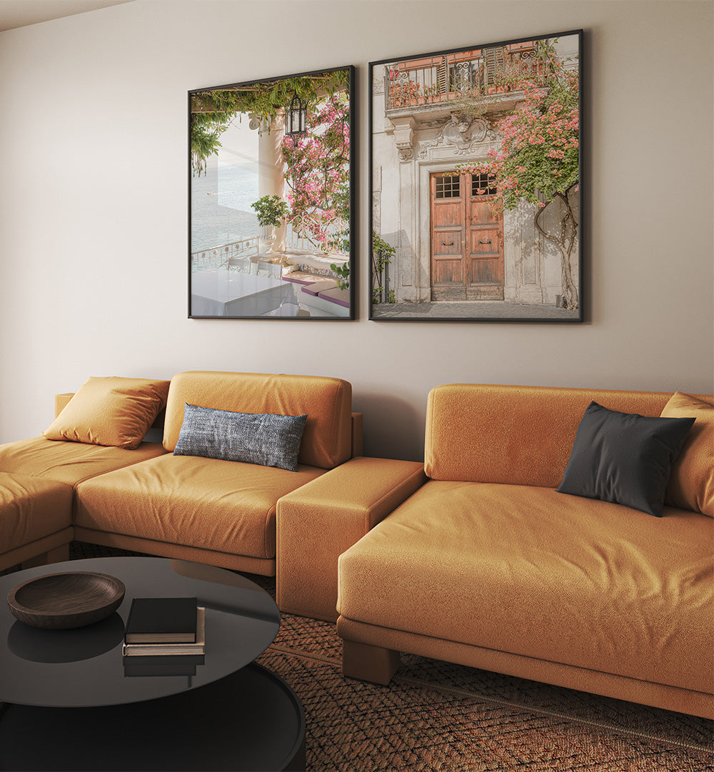 Modern living room with a mustard yellow sectional sofa, decorative pillows, and two framed artworks on the wall.