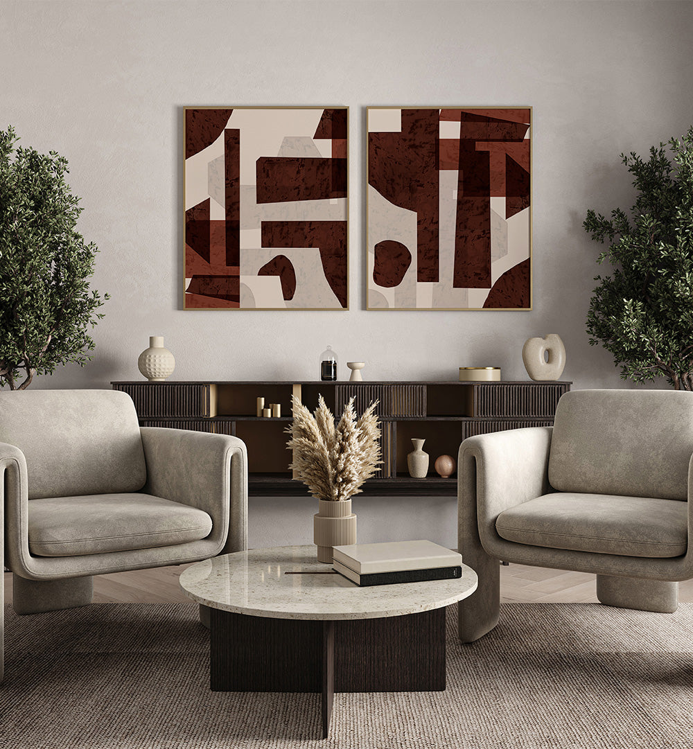 Modern living room with gray armchairs, a marble coffee table, and abstract wall art.