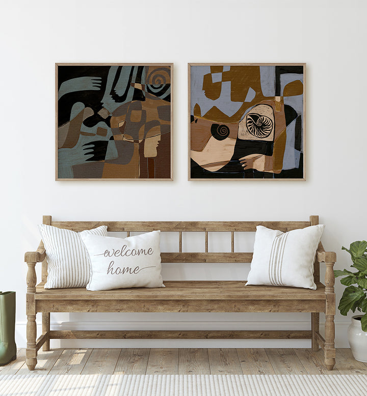 Wooden bench with decorative pillows and abstract art on a white wall